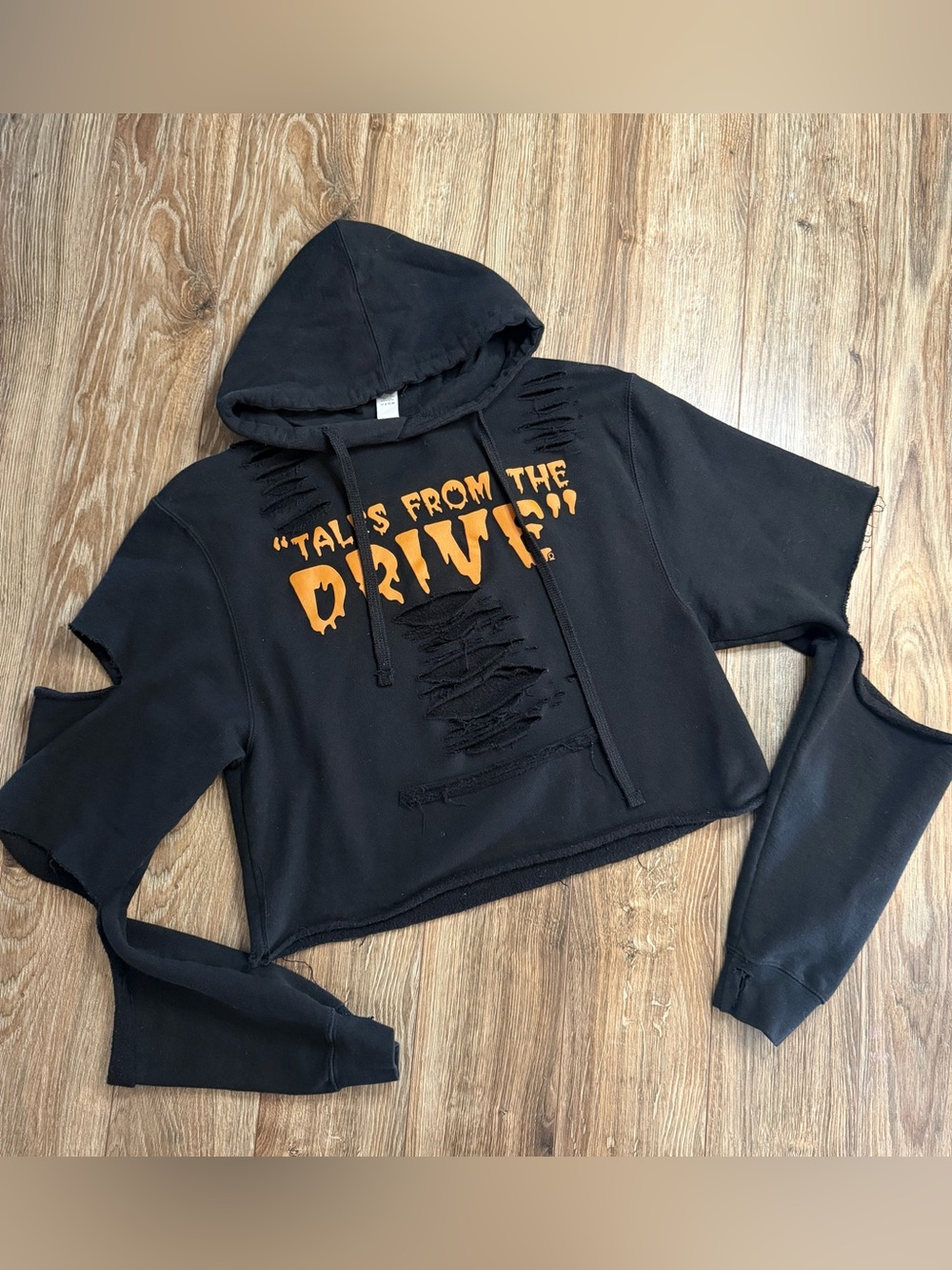 Black Cropped Distressed Hoodie with Orange Skull Graphic Tales From the Drive